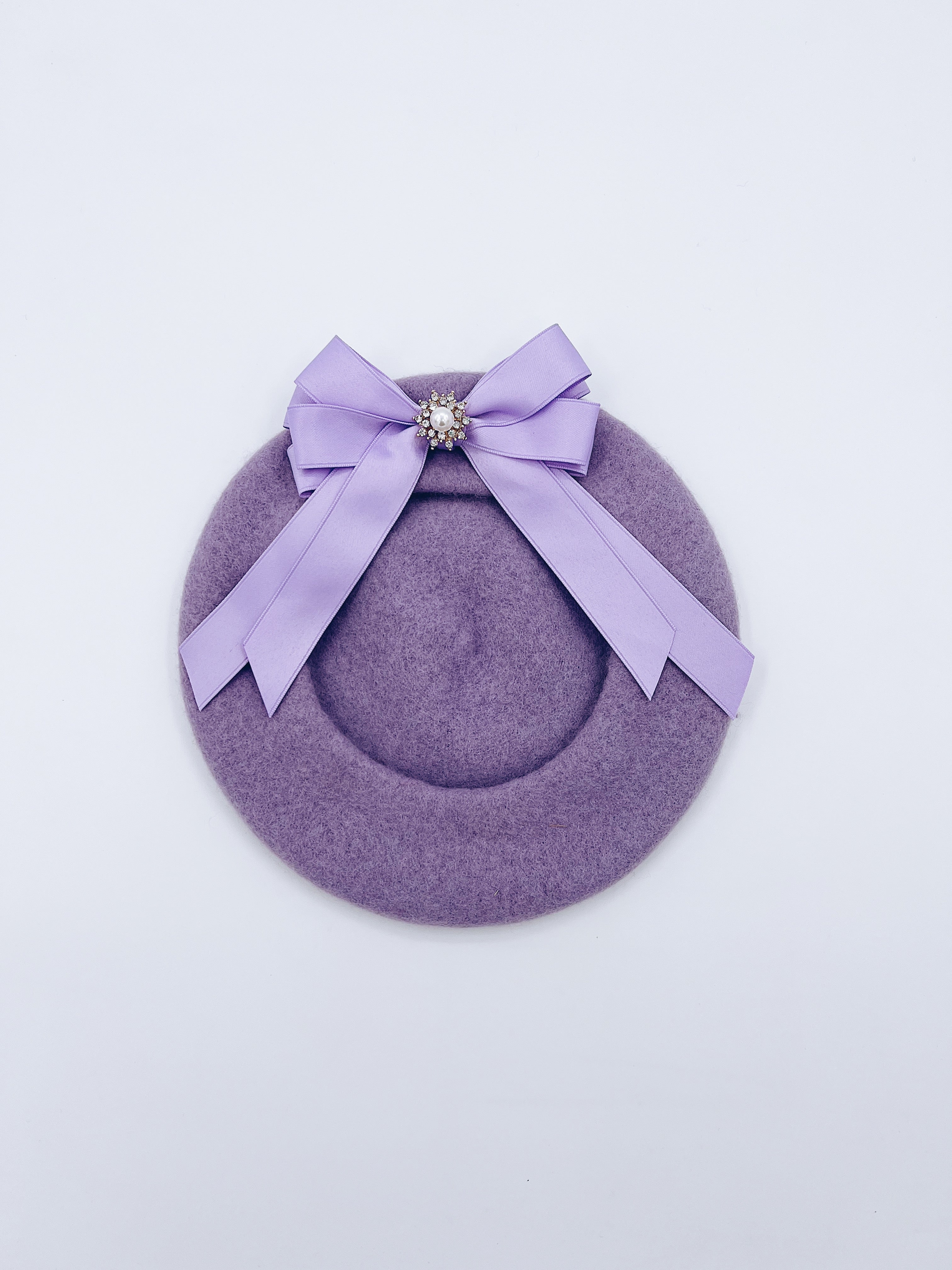Classic Kids wool beret with beautiful bow details.