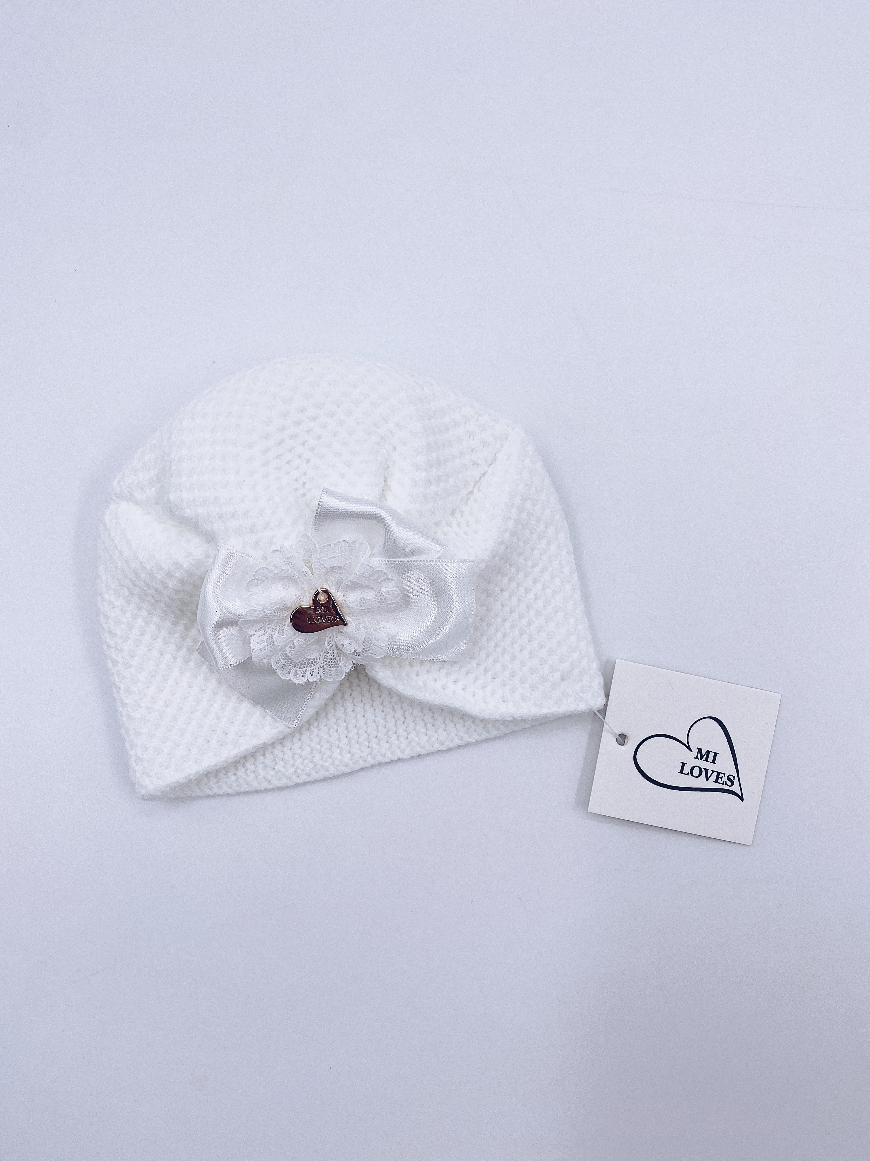 MI LOVEE SIGNATURE Luxurious knitted Turban hat with lace detail.