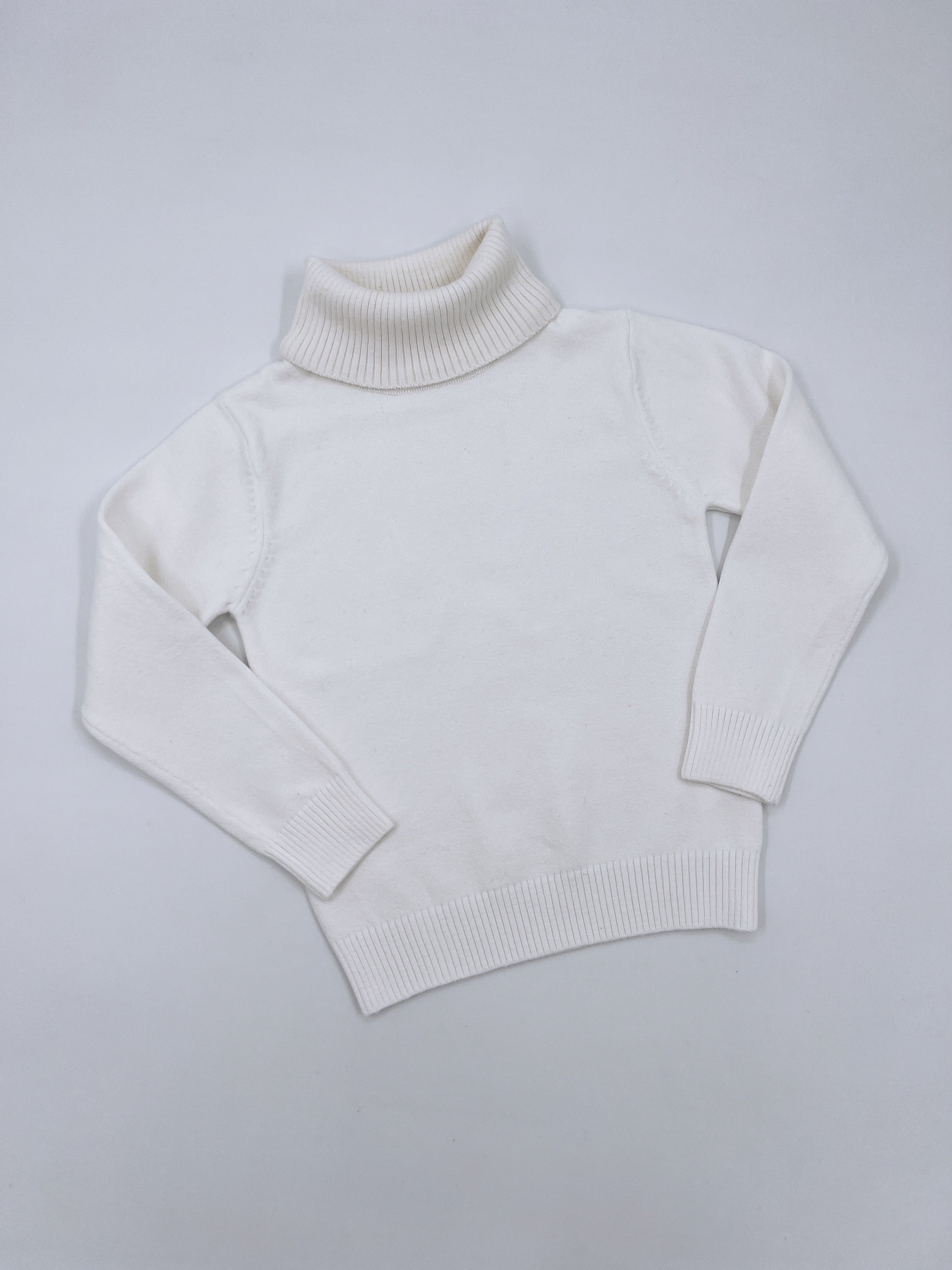 Turtleneck jumper.