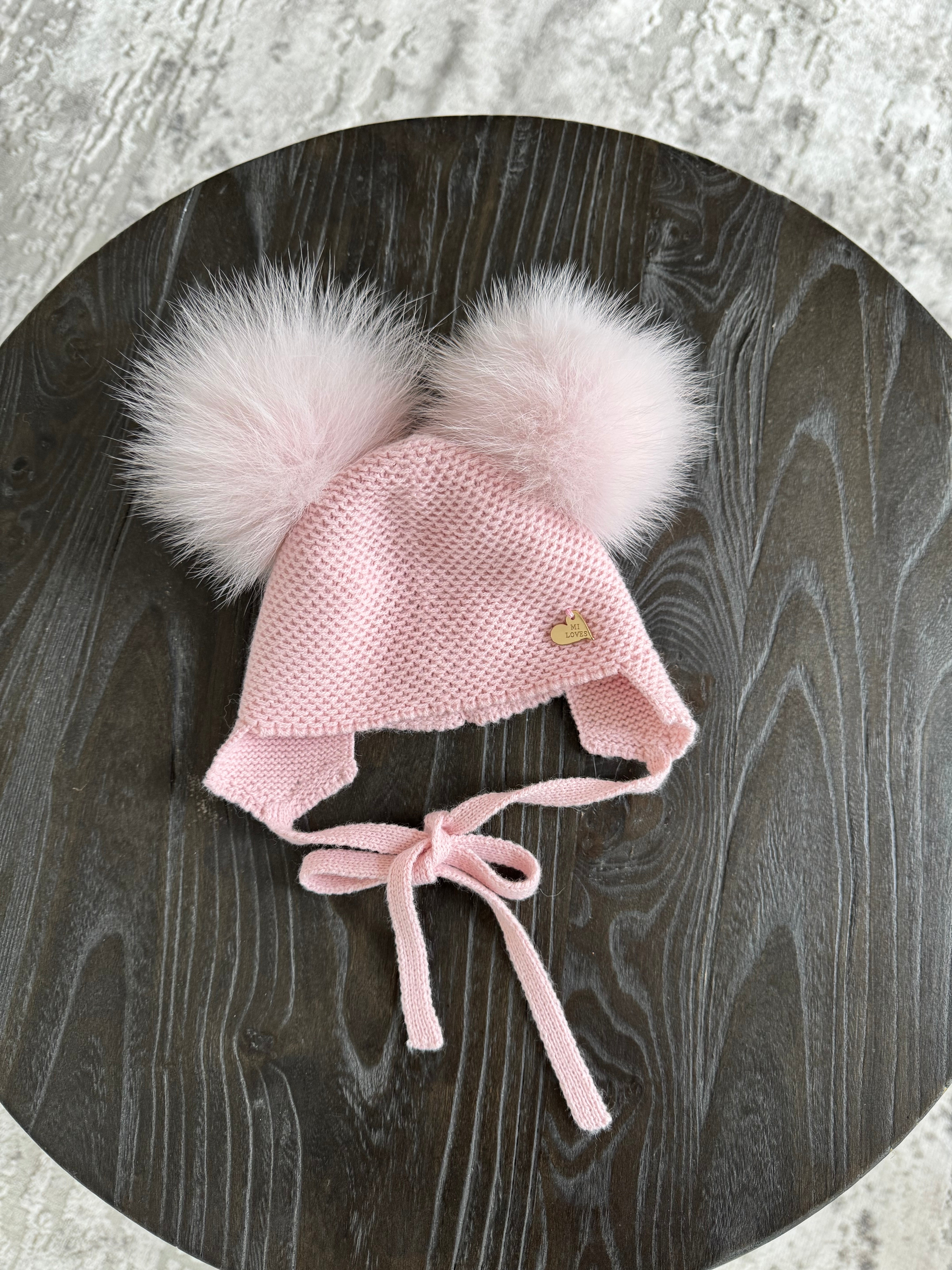 Knitted Double pompom hat .