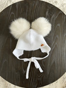 Knitted Double pompom hat .