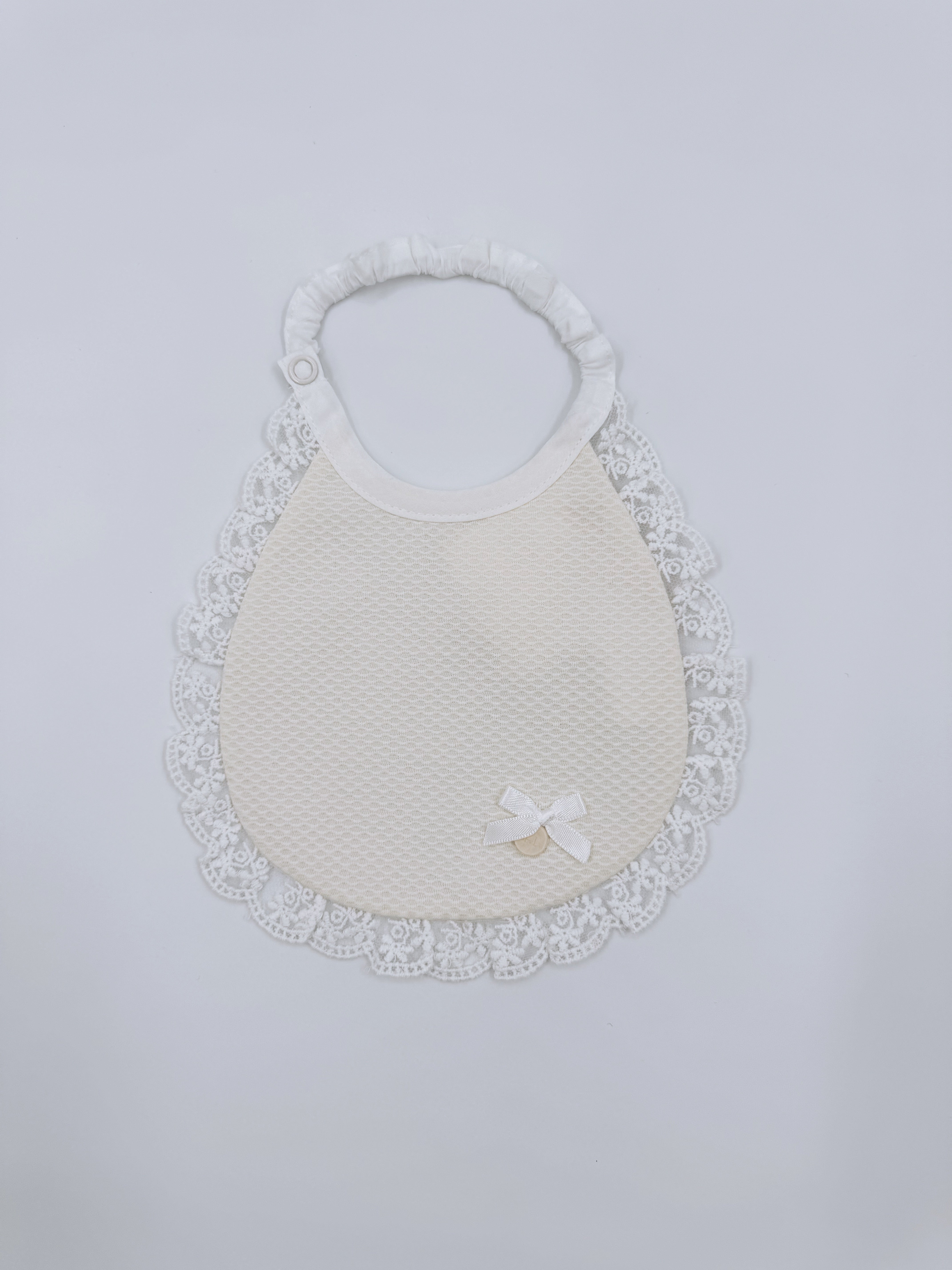 Beautiful baby bib with lace details