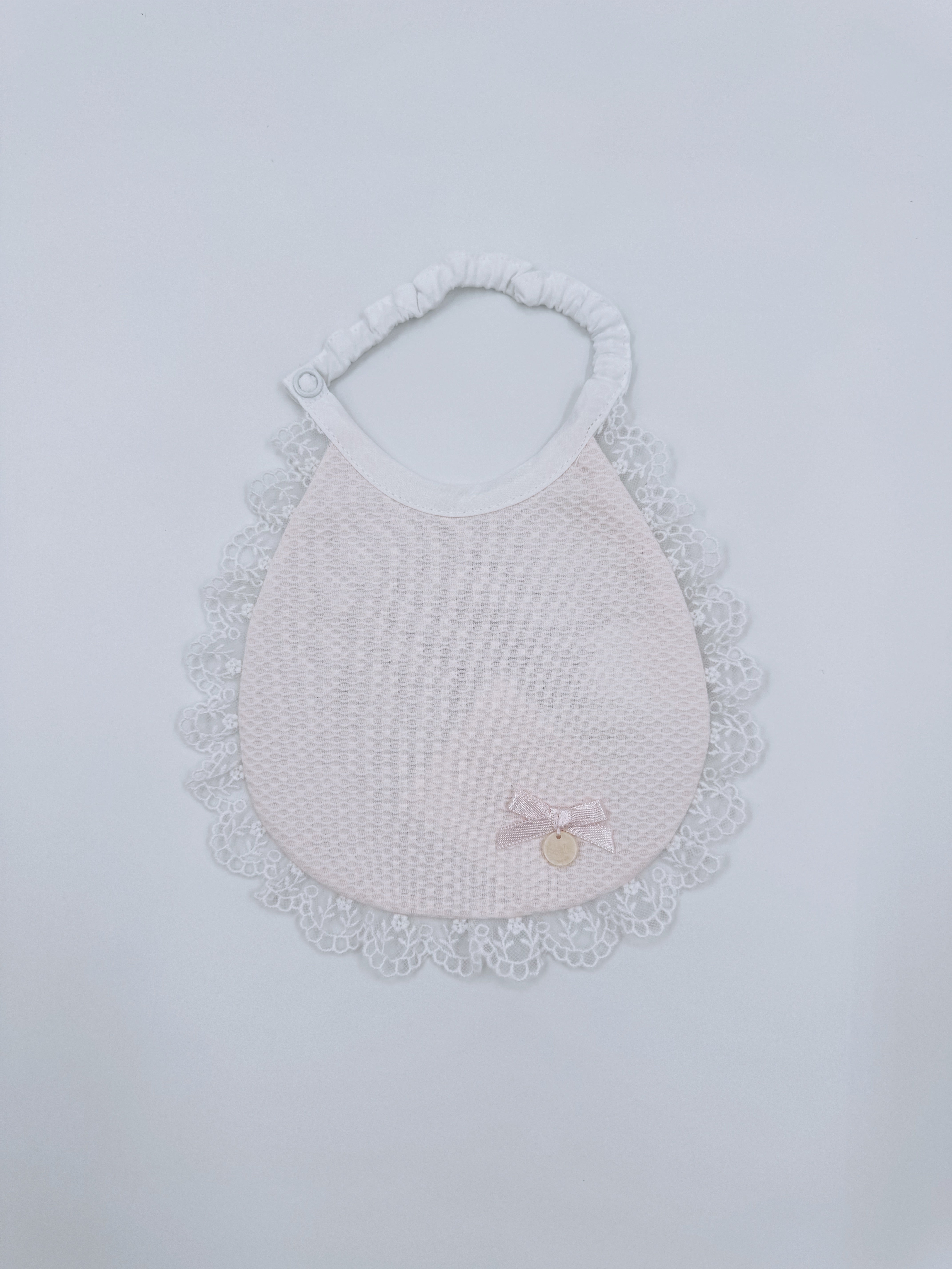 Beautiful baby bib with lace details
