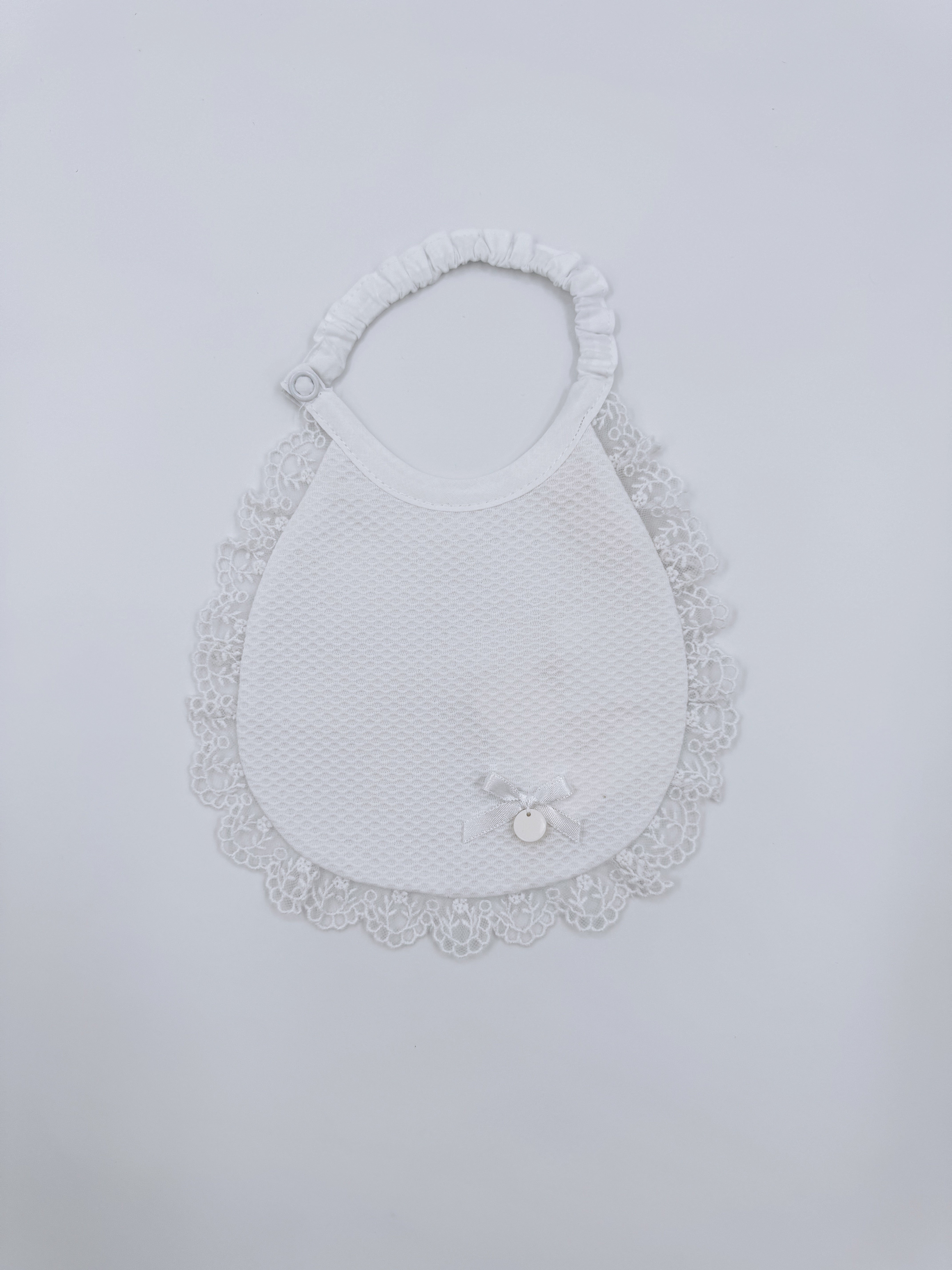 Beautiful baby bib with lace details