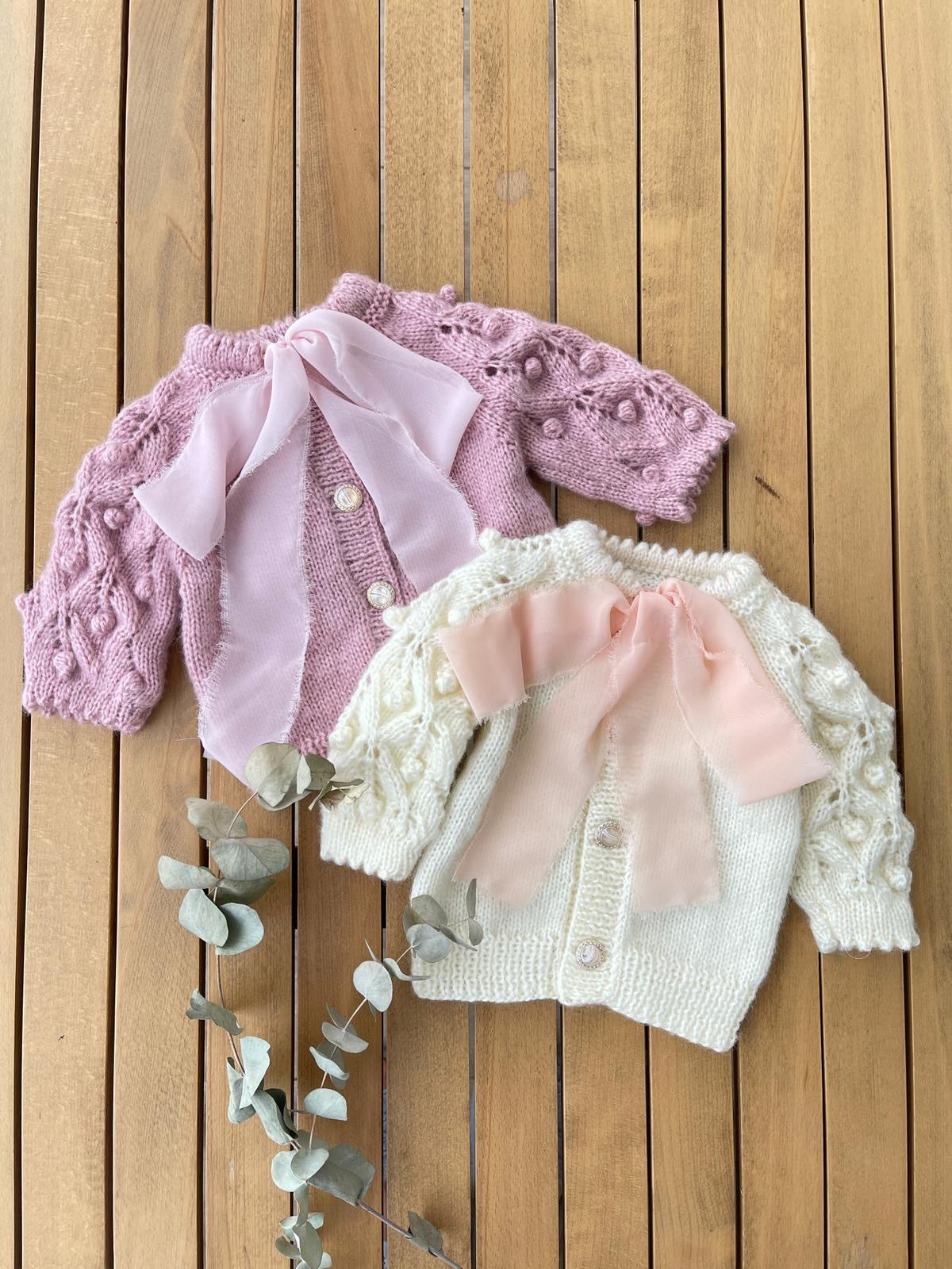 Beautiful Hand Knitted Cardigan with Bow details.